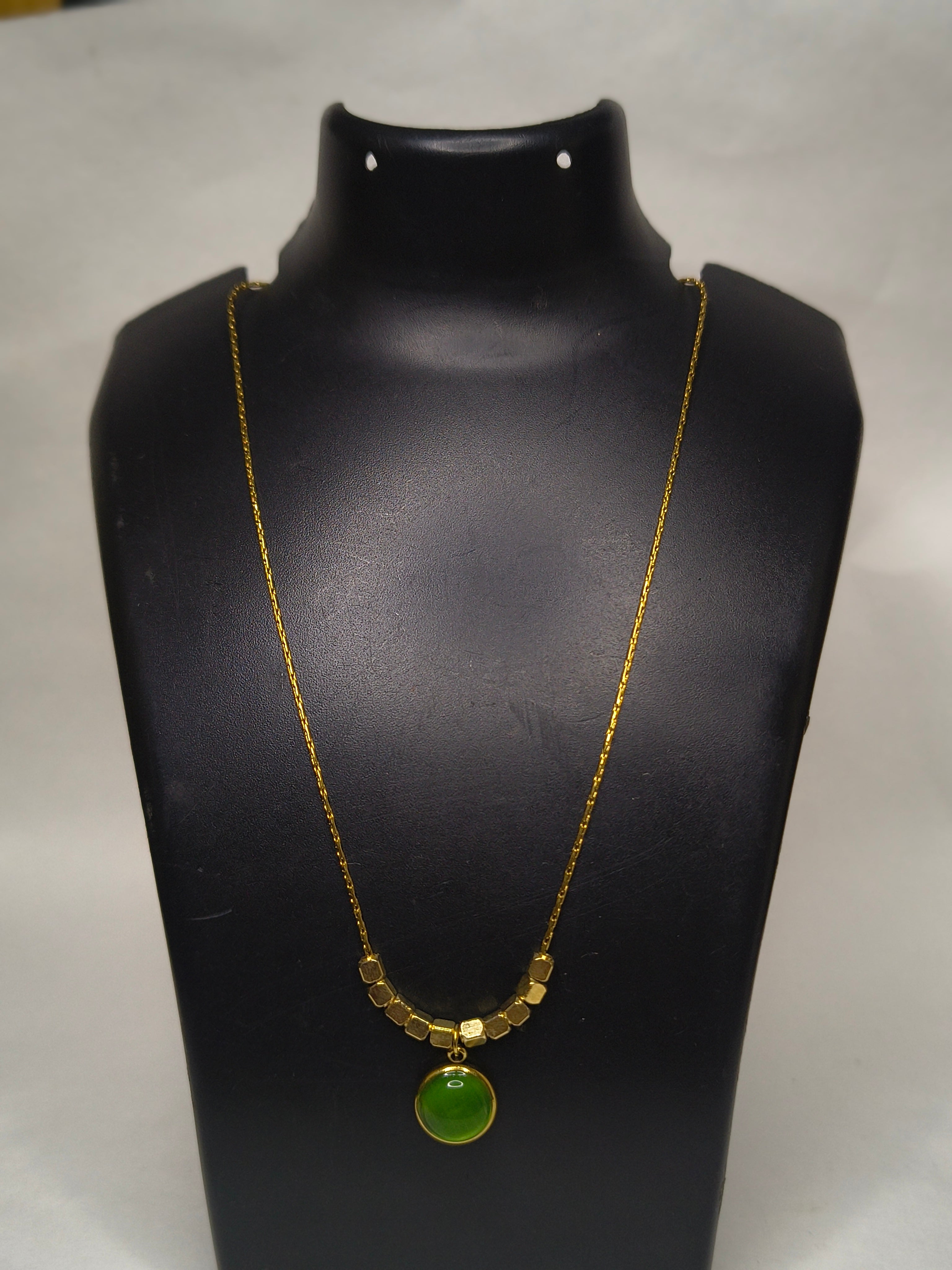 cubes and green stone pendant.